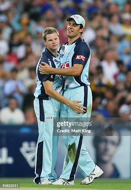 Steve Smith of the Blues celebrates with Moises Henriques after catching Aaron O'Brien of the Redbacks off his own bowling during the Twenty20 Big...