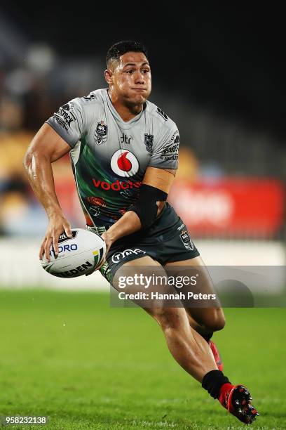 Roger Tuivasa-Sheck passes the ball out during the round 10 NRL match between the New Zealand Warriors and the Sydney Roosters at Mt Smart Stadium on...