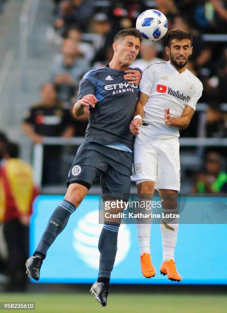 Ben Sweat of New York City FC and Diego Rossi of Los Angeles FC fight for control of the ball at Banc of California Stadium on May 13, 2018 in Los...