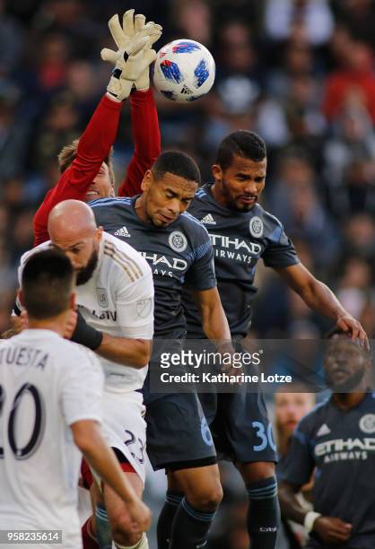 Tyler Miller of Los Angeles FC , Alexander Callens of New York City FC , and Yangel Herrera of New York City FC fight for control of the ball at Banc...