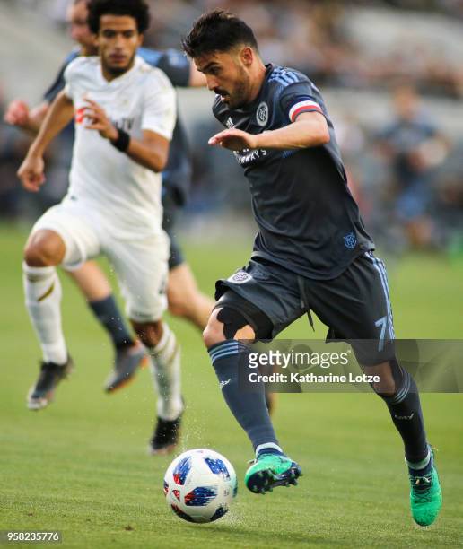 David Villa of New York City FC dribbles down the field at Banc of California Stadium on May 13, 2018 in Los Angeles, California.