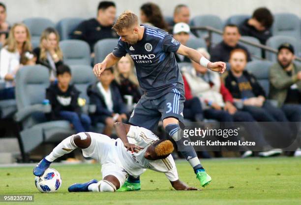 Latif Blessing of Los Angeles FC and Anton Tinnerholm of New York City FC fight for control of the ball at Banc of California Stadium on May 13, 2018...