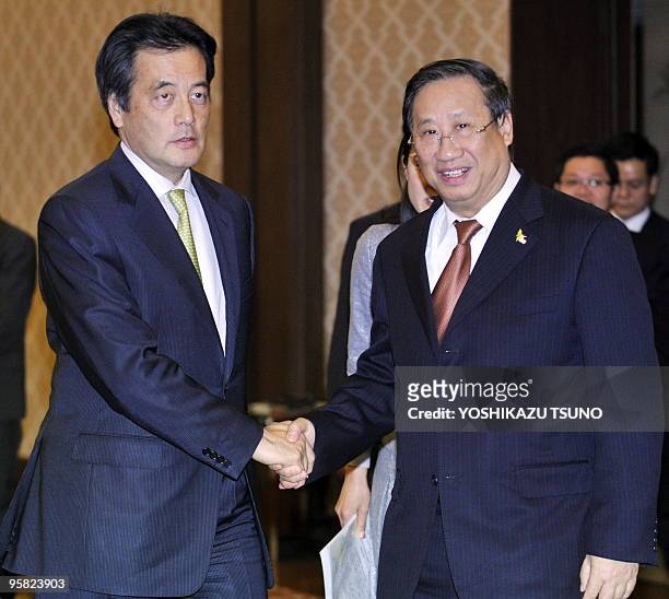 Vietnamese Foreign Minister Pham Gia Khiem shakes hands with his Japanese counterpart Katsuya Okada prior to their talks at the Iikura guesthouse in...