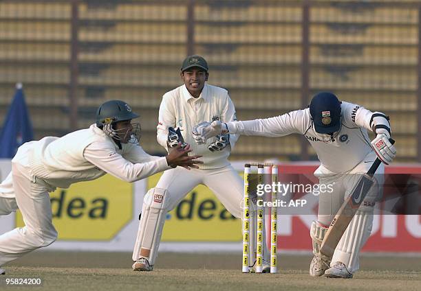 Bangladeshi cricketer Raqibul Hasan takes a catch as Indian cricketer Zaheer Khan and Bangladeshi wicketkeeper Mushfiqur Rahim react during the first...