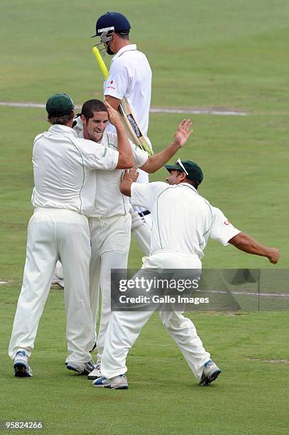 Wayne Parnell of South Africa celebrates the wicket of Kevin Pietersen of England with his team mates during day 4 of the 4th Test match between...
