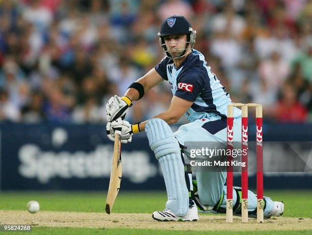 Phil Hughes of the Blues plays an off side stroke during the Twenty20 Big Bash match between the New South Wales Blues and the South Australian...