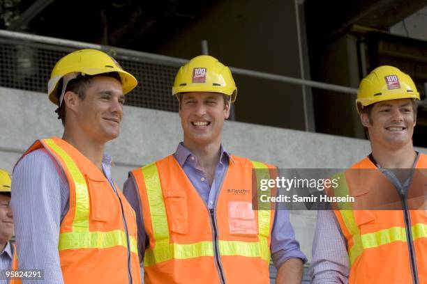 Prince William stands with All Blacks rugby players Dan Carter and Richie McCaw as they view developments at Eden Park for the 2011 Rugby World Cup...