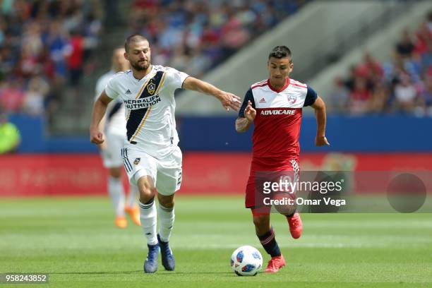 Mauro Diaz of FC Dallas controls the ball against Perry Kitchen of LA Galaxy during the Major Soccer League match between Dallas FC and LA Galaxy at...