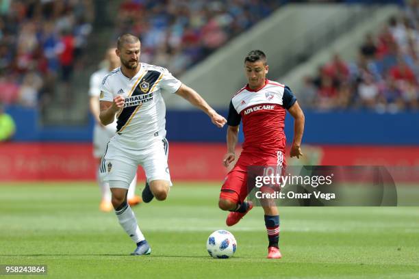 Mauro Diaz of FC Dallas controls the ball against Perry Kitchen of LA Galaxy during the Major Soccer League match between Dallas FC and LA Galaxy at...