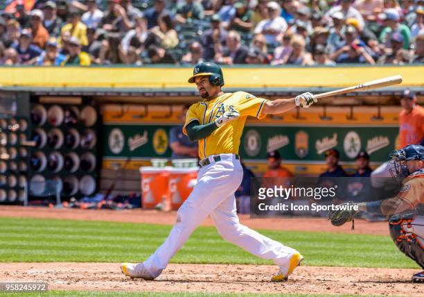Oakland Athletics Shortstop Marcus Semien swings through a strike during the game between the Houston Astros and the Oakland Athletics on May 9, 2018...