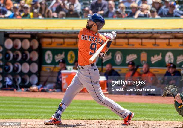 Houston Astros Outfield Marwin Gonzalez watches his fly ball during the game between the Houston Astros and the Oakland Athletics on May 9, 2018 at...