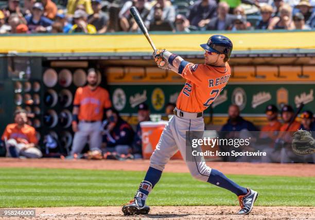 Houston Astros Right field Josh Reddick follows through on a hit during the game between the Houston Astros and the Oakland Athletics on May 9, 2018...