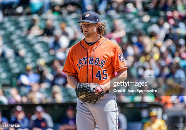 Houston Astros Starting pitcher Gerrit Cole takes a look at second base before delivering a pitch during the game between the Houston Astros and the...