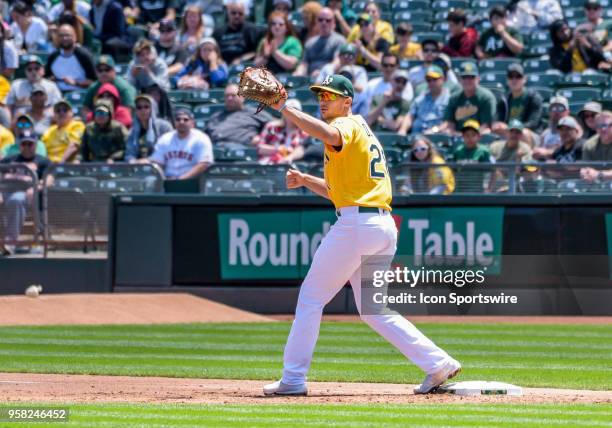 Oakland Athletics First base Matt Olson makes the tag for the out on Houston Astros Catcher Max Stassi during the game between the Houston Astros and...