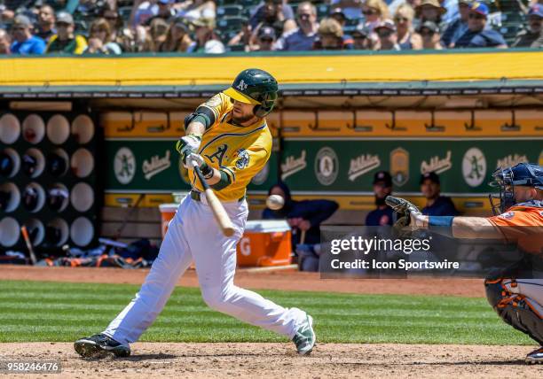 Oakland Athletics Second base Jed Lowrie fouls off a ball during the game between the Houston Astros and the Oakland Athletics on May 9, 2018 at O.co...