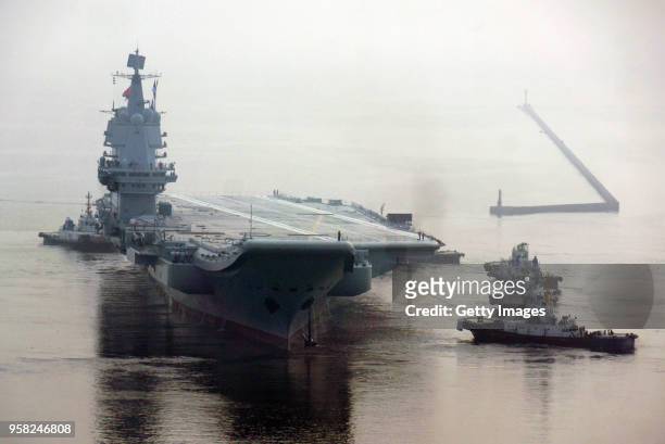 China's first home-built aircraft carrier sets out from a port of Dalian DSIC Shipyard for sea trials on May 13, 2018 in Dalian, Liaoning Province of...