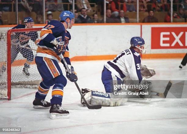 Ken Wregget of the Toronto Maple Leafs skates against Gino Cavallinni of the St. Louis Blues during NHL game action On December 12, 1988 at Maple...