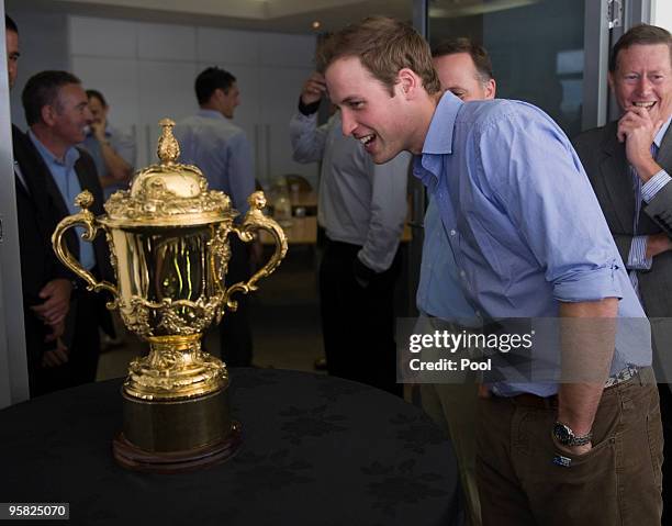 Prince William, and New Zealand Prime Minster John Key look at the Webb Ellis Cup on the first day of his visit to New Zealand at Eden Park on...