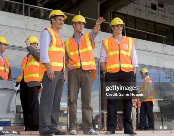 Prince William stands with All Blacks rugby players Dan Carter and Richie McCaw as they view developments at Eden Park for the 2011 Rugby World Cup...