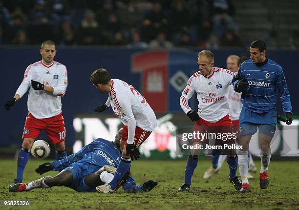 Mladen Petric , Tunay Torun and David Jarolim of Hamburg and Jackson Mendy and Ömer Toprak battle for the ball during the Bundesliga match between...