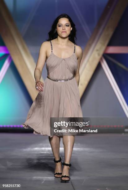 Michelle Rodriguez walks the runway during Fashion For Relief Cannes 2018 during the 71st annual Cannes Film Festival at Aeroport Cannes Mandelieu on...