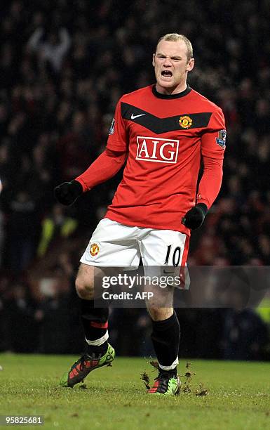 Manchester United's English forward Wayne Rooney celebrates after scoring the second goal of the English Premier League football match between...