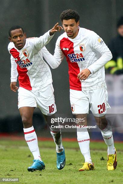 Ibrahim Traore of Augsburg celebrates his team's second goal scored by Sandor Torghelle with Marcel Ndjeng during the Second Bundesliga match between...