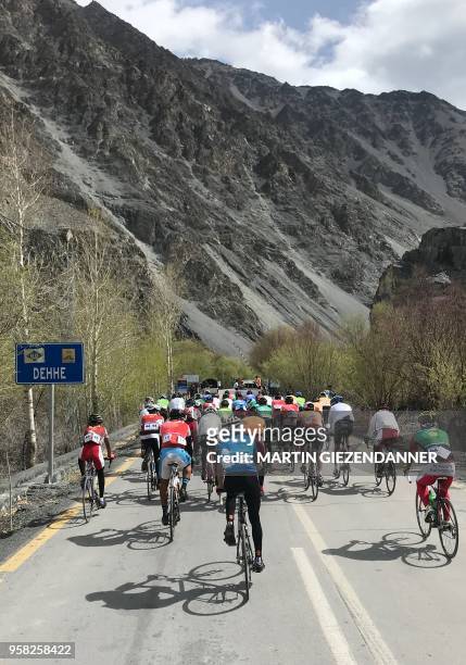 This picture taken on May 13 shows Pakistani and foreign cyclists taking part in a race of 'Tour de Khunjerab' in Gojal, in the Gilgit-Baltistan...