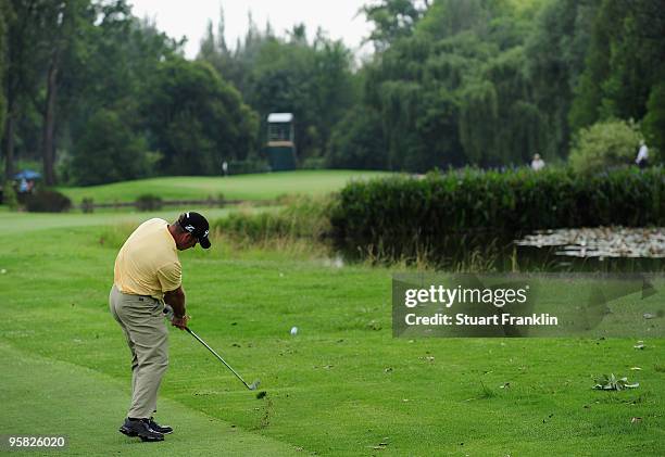 Hennie Otto of South Africa plays his approach shot on the sixth hole during the final round of the Joburg Open at Royal Johannesburg and Kensington...