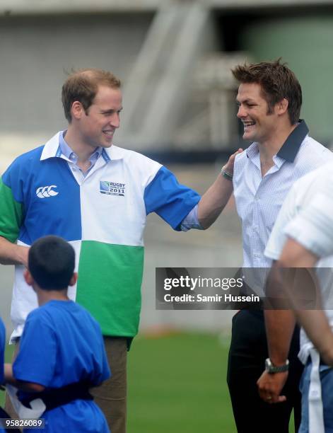 Prince William and All Black captain Richie McCaw chat to children at Eden Park Stadium on the first day of his visit to New Zealand on January 17,...