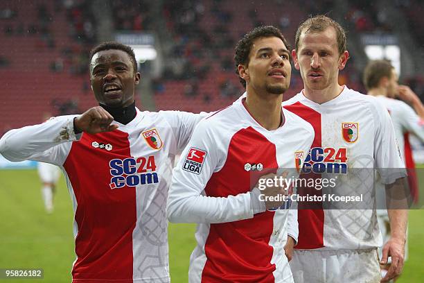 Marcel Ndjeng of Augsburg celebrates the third goal with Andrew Sinkala and Sándor Torghelle during the Second Bundesliga match between FC Augsburg...