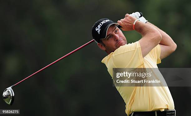 Hennie Otto of South Africa plays his tee shot on the fourth hole during the final round of the Joburg Open at Royal Johannesburg and Kensington Golf...