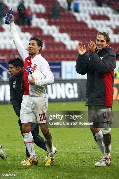 Elton da Costa, Marcel Ndjeng and Jonas de Roeck of Augsburg celebrate the 3-1 victory after the Second Bundesliga match between FC Augsburg and...