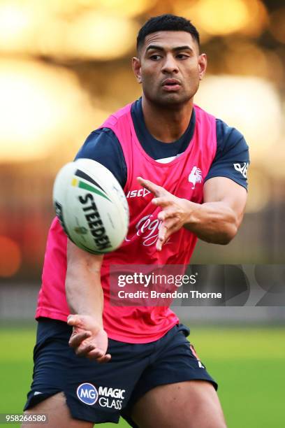 Daniel Tupou of the Roosters passes the ball to a team mate during a Sydney Roosters NRL training session at Kippax Oval on May 14, 2018 in Sydney,...