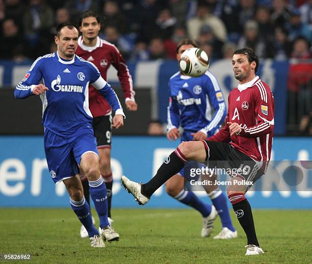 Heiko Westermann of Schalke and Albert Bunjaku of Nuernberg battle for the ball during the Bundesliga match between FC Schalke 04 and 1. FC Nuernberg...