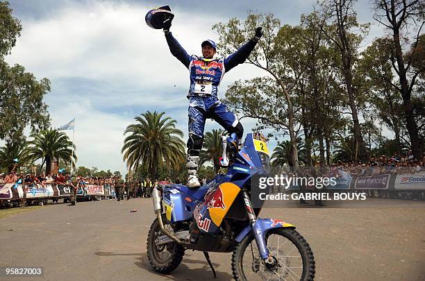 France's Cyril Despres celebrates after the 14th stage of the Dakar 2010, between Santa Rosa and Buenos Aires, Argentina on January 16, 2010....