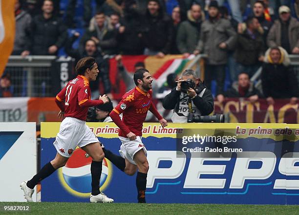 Simone Perrotta and Rodrigo Taddei of AS Roma celebrate the opening goal during the Serie A match between Roma and Genoa at Stadio Olimpico on...