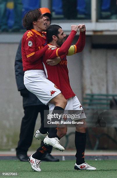 Simone Perrotta and Rodrigo Taddei of AS Roma celebrate the opening goal during the Serie A match between Roma and Genoa at Stadio Olimpico on...