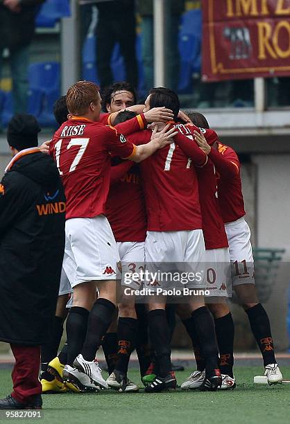 Simone Perrotta , John Arne Riise and players of AS Roma celebrate the opening goal during the Serie A match between Roma and Genoa at Stadio...