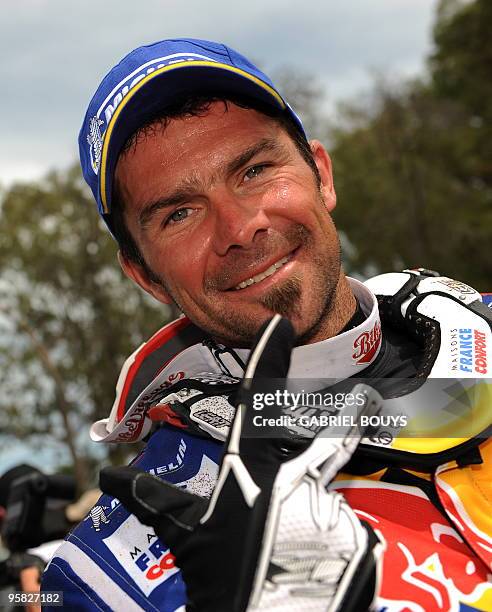 France's Cyril Despres celebrates after the 14th stage of the Dakar 2010, between Santa Rosa and Buenos Aires, Argentina on January 16, 2010....