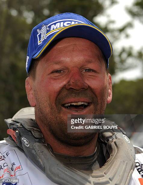 France's former rugby player Christian Califano celebrates after the 14th stage of the Dakar 2010, between Santa Rosa and Buenos Aires, Argentina on...