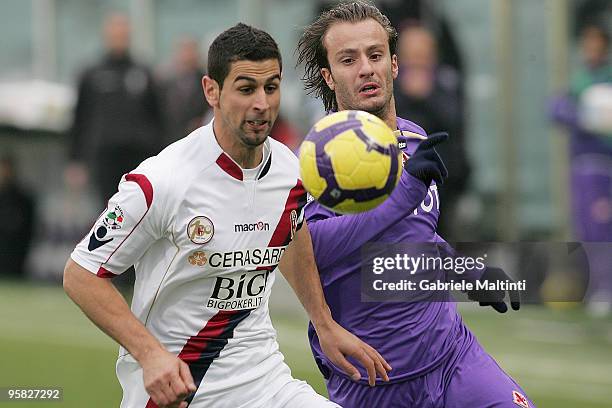 Alberto Gilardino of ACF Fiorentina in action against Miguel Angel Britos of Bologna FC during the Serie A match between Fiorentina and Bologna at...