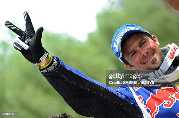 France's Cyril Despres celebrates after winning the 14th stage of the Dakar 2010, between Santa Rosa and Buenos Aires, Argentina on January 16, 2010....