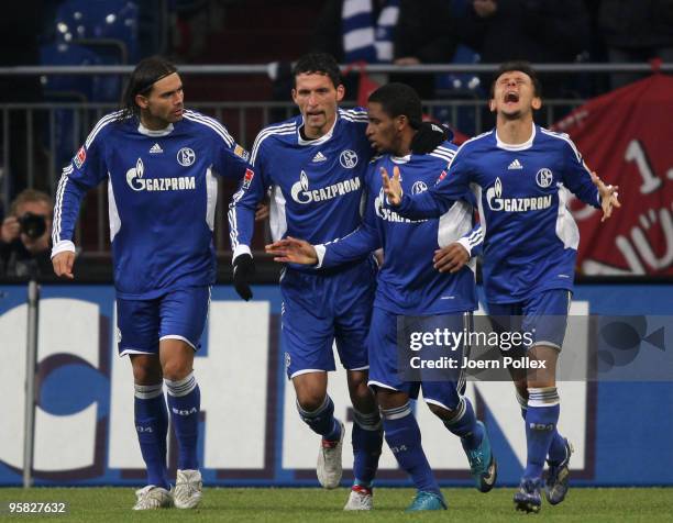 Kevin Kuranyi of Schalke celebrates with his team mates Edu , Jefferson Farfan and Rafinha after scoring his team's first goal during the Bundesliga...