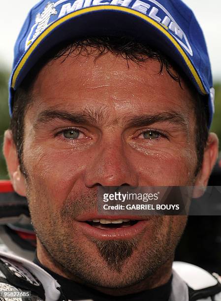 France's Cyril Despres celebrates after the 14th stage of the Dakar 2010, between Santa Rosa and Buenos Aires, Argentina on January 16, 2010....