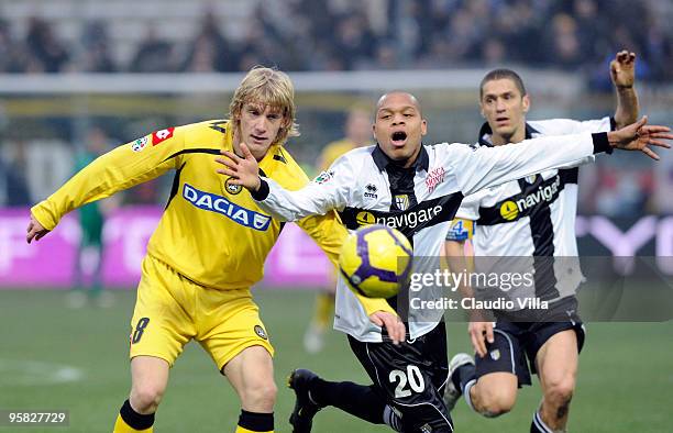 Jonathan Biabiany of Parma FC competes for the ball with Dusan Basta of Udinese Calcio during the Serie A match between Parma and Udinese at Stadio...