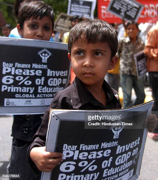 Child activists of National Coalition for Education raising slogan during a rally demanding right to education be immediately enacted to ensure...