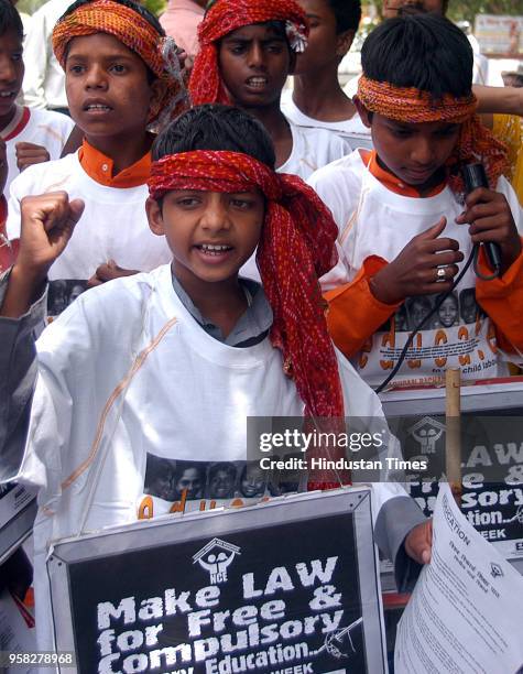 Child activists of National Coalition for Education raising slogan during a rally demanding right to education be immediately enacted to ensure...