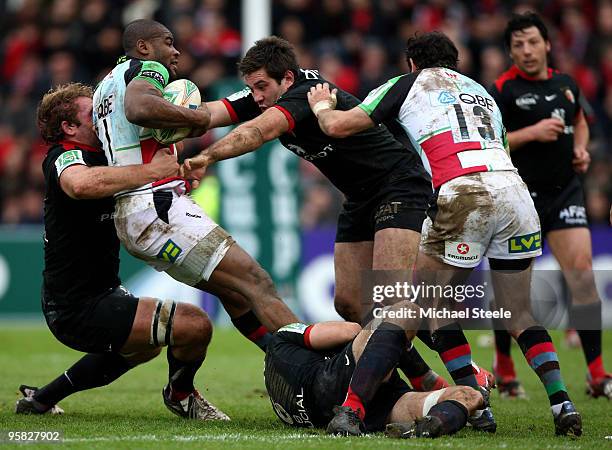 Ugo Monye of Harlequins is tackled to the ground by Romain Millo-Chluski and Florian Fritz during the Toulouse v Harlequins Heineken Cup Pool 5 match...