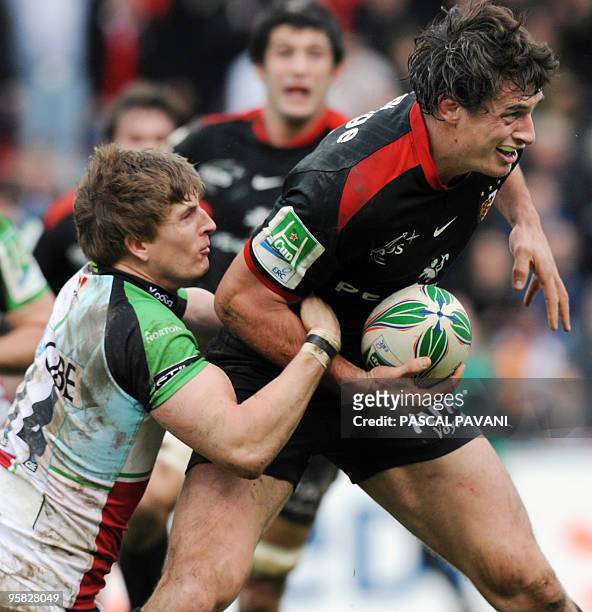 Toulouse's centre Yannick Jauzion collapses with London Harlequins's winger David Strettle during their European Cup rugby union match Toulouse vs...